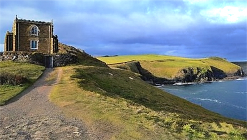 Doyden Castle on the cliff path, looking west towards The Rumps headland